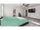 Large bedroom with a king bed, attached bathroom, and a TV at 146 Dogwood Grove Pl, Troutman, NC 28166