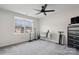 Spacious bedroom with window, ceiling fan and gray carpet at 146 Dogwood Grove Pl, Troutman, NC 28166