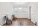 Bright dining area with hardwood floors and chair at 146 Dogwood Grove Pl, Troutman, NC 28166