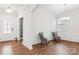 Elegant dining room with hardwood floors and wainscoting at 146 Dogwood Grove Pl, Troutman, NC 28166