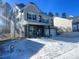 Two-story house with gray siding, stone accents, and a covered porch at 146 Dogwood Grove Pl, Troutman, NC 28166