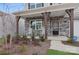 Front porch with rocking chairs and stone details at 146 Dogwood Grove Pl, Troutman, NC 28166