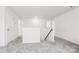 Upstairs hallway with grey carpet and access to bedrooms and bathrooms at 146 Dogwood Grove Pl, Troutman, NC 28166