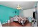 Bright bedroom with a queen bed and teal walls at 2465 Cedar Valley Dr, Conover, NC 28613