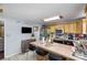 Galley style kitchen with island and wood cabinets at 2465 Cedar Valley Dr, Conover, NC 28613