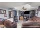 Spacious living room with brown leather couches and fireplace at 2465 Cedar Valley Dr, Conover, NC 28613