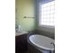 Bathroom boasts a garden tub and granite countertop at 250 Bost Rd, China Grove, NC 28023