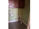 Convenient laundry room with cabinets and flooring at 250 Bost Rd, China Grove, NC 28023