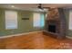 Living room with stone fireplace and hardwood floors at 250 Bost Rd, China Grove, NC 28023