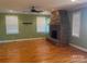 Living room with stone fireplace and hardwood floors at 250 Bost Rd, China Grove, NC 28023