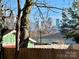 Backyard view of city skyline over wooden fence at 2514 Ringwood St, Charlotte, NC 28208