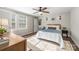 Cozy bedroom with wood floors, ceiling fan, and a comfortable bed at 2514 Ringwood St, Charlotte, NC 28208