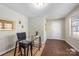 Bright home office with glass desk and wood floors at 2514 Ringwood St, Charlotte, NC 28208