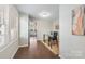 Home office with glass desk and view into another room at 2514 Ringwood St, Charlotte, NC 28208