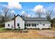 White farmhouse with a spacious backyard and garden at 2633 Jb Denton Rd, Lancaster, SC 29720