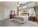 Spacious main bedroom with high ceilings, large windows, and ceiling fan at 2633 Jb Denton Rd, Lancaster, SC 29720