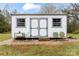 White storage shed with gray trim and metal chairs at 2633 Jb Denton Rd, Lancaster, SC 29720