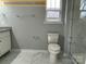 Clean bathroom with toilet, shower, and granite vanity at 305 General As Johnston St, Stanley, NC 28164