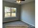 Bright bedroom with carpet flooring and a large window at 305 General As Johnston St, Stanley, NC 28164