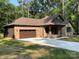 Beautiful home featuring a covered porch, attached garage, and a newly installed driveway with fresh sod at 305 General As Johnston St, Stanley, NC 28164