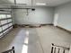 A spacious garage with an electric garage door is perfect for storing your vehicles at 305 General As Johnston St, Stanley, NC 28164