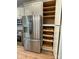 Stainless steel refrigerator and pantry featuring pull-out shelves at 305 General As Johnston St, Stanley, NC 28164
