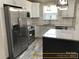 Stainless steel appliances and granite countertops in this modern kitchen at 305 General As Johnston St, Stanley, NC 28164