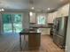 Modern kitchen with stainless steel appliances, granite counters and center island at 305 General As Johnston St, Stanley, NC 28164