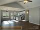 Open concept kitchen with island and stainless steel appliances at 305 General As Johnston St, Stanley, NC 28164