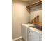 Laundry room with washer, dryer and custom wood shelving at 305 General As Johnston St, Stanley, NC 28164