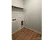 Functional laundry room featuring wood-look floors and a wire rack for storage at 305 General As Johnston St, Stanley, NC 28164