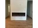 Bright living room features modern fireplace and hardwood floors at 305 General As Johnston St, Stanley, NC 28164