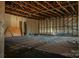 Unfinished basement with exposed beams and wooden floors at 327 S Grove St, Lincolnton, NC 28092