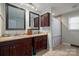 Bathroom with double vanity, granite countertops, and shower at 327 S Grove St, Lincolnton, NC 28092