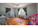 bedroom with play area and hardwood floors at 327 S Grove St, Lincolnton, NC 28092