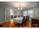 Bright dining room with hardwood floors and chandelier at 327 S Grove St, Lincolnton, NC 28092