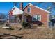 Brick home with a front porch and a fenced yard at 327 S Grove St, Lincolnton, NC 28092