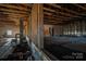 Unfinished interior with exposed wooden beams and framing at 327 S Grove St, Lincolnton, NC 28092