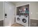 Convenient laundry room with washer, dryer, and storage at 327 S Grove St, Lincolnton, NC 28092