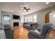 Living room featuring hardwood floors, fireplace and large windows at 327 S Grove St, Lincolnton, NC 28092