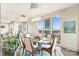 Bright dining area with glass table, modern chairs, and city view at 333 W Trade St # 1204, Charlotte, NC 28202