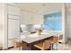 Modern kitchen with white cabinets and a blue accent wall at 333 W Trade St # 1204, Charlotte, NC 28202