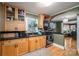 Modern kitchen with light wood cabinets and black countertops at 3513 Startown Rd, Newton, NC 28658