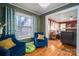 Two blue armchairs in a living area with hardwood floors at 3513 Startown Rd, Newton, NC 28658