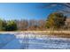 Open lot with snow and tire tracks, partially fenced at 3513 Startown Rd, Newton, NC 28658