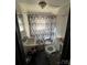 Bathroom with a shower/tub combo and updated toilet at 416 Richardson St, Albemarle, NC 28001