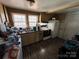 Small kitchen with light colored cabinets and appliances at 416 Richardson St, Albemarle, NC 28001