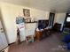 Living room with fireplace, TV, and ample space at 416 Richardson St, Albemarle, NC 28001