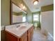 Bathroom with double vanity and a separate tub and shower at 44101 Millingport Rd, Richfield, NC 28137