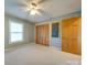 Bedroom with ceiling fan, closet, and neutral walls at 44101 Millingport Rd, Richfield, NC 28137